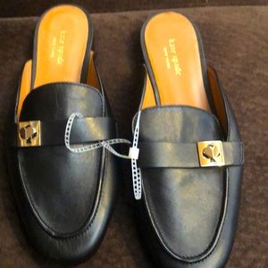 New Never worn Kate Spade black flat slides . Gold heart buckle .